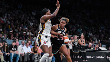 Jul 16, 2025; Brooklyn, New York, USA; New York Liberty center Nyara Sabally (8) drives to the basket while defended by Indiana Fever forward Aliyah Boston (7) during the first half at Barclays Center. Mandatory Credit: John Jones-Imagn Images