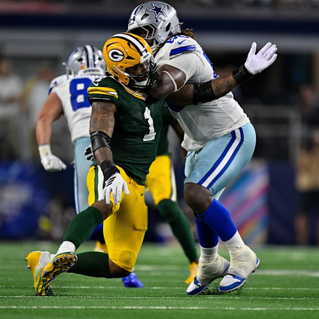 Dallas Cowboys offensive tackle Tyler Guyton (60) blocks Green Bay Packers defensive end Micah Parsons.