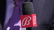 Sep 1, 2024; San Francisco, California, USA; Miami Marlins in-game reporter Craig Minervini holds a microphone with a Bally sports mic flag before the game against the San Francisco Giants at Oracle Park. 