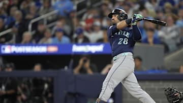 Oct 20, 2025; Toronto, Ontario, CAN; Seattle Mariners third baseman Eugenio Suarez (28) hits a single against the Toronto Blue Jays in the second inning during game seven of the ALCS round for the 2025 MLB playoffs at Rogers Centre.  Mandatory Credit: John E. Sokolowski-Imagn Images
