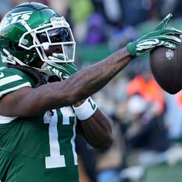 New York Jets wide receiver Davante Adams (17) celebrates after getting on the scoreboard first with a first quarter touchdown, Sunday, December 22, 2024, in East Rutherford.