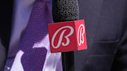 Sep 1, 2024; San Francisco, California, USA; Miami Marlins in-game reporter Craig Minervini holds a microphone with a Bally sports mic flag before the game against the San Francisco Giants at Oracle Park. Mandatory Credit: Darren Yamashita-Imagn Images