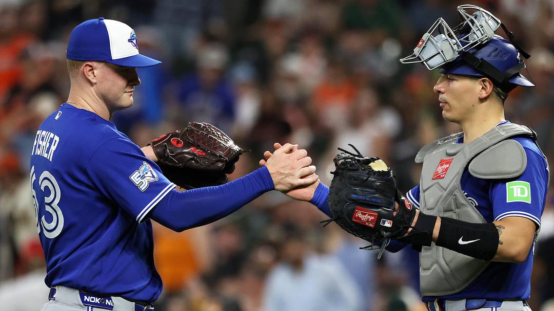 Toronto Blue Jays pitcher Braydon Fisher celebrates with catcher Brandon Valenzuela after a game.