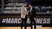 Mar 20, 2021; Indianapolis, Indiana, USA; Alabama Crimson Tide head coach Nate Oats (left) greets Iona Gaels head coach Rick Pitino after their game during the first round of the 2021 NCAA Tournament at Hinkle Fieldhouse. Mandatory Credit: Marc Lebryk-Imagn Images