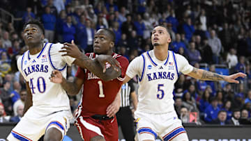 Mar 20, 2025; Providence, RI, USA;  Arkansas Razorbacks guard Johnell Davis (1) and Kansas Jayhawks forward Flory Bidunga (40) and guard Zeke Mayo (5) look on during the second half at Amica Mutual Pavilion. Mandatory Credit: Eric Canha-Imagn Images