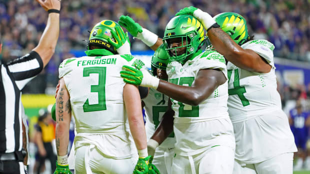 Oregon Ducks tight end Terrance Ferguson celebrates with team mates after scoring a touchdown against the Washington Huskies.