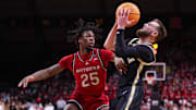 Purdue Boilermakers guard Braden Smith is guarded by Rutgers Scarlet Knights guard Jeremiah Williams 