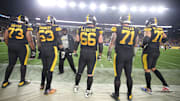 Dec 15, 2019; Pittsburgh, PA, USA;   Pittsburgh Steelers head coach Mike Tomlin (third from left) talks with offensive lineman guard Ramon Foster (73) and center Maurkice Pouncey (53) and guard David DeCastro (66) and tackle Matt Feiler (71) and tackle Alejandro Villanueva (78) on the sidelines against the Buffalo Bills during the fourth quarter at Heinz Field.  Buffalo won 17-10. Mandatory Credit: Charles LeClaire-Imagn Images