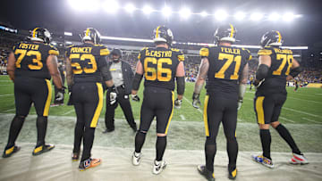Dec 15, 2019; Pittsburgh, PA, USA;   Pittsburgh Steelers head coach Mike Tomlin (third from left) talks with offensive lineman guard Ramon Foster (73) and center Maurkice Pouncey (53) and guard David DeCastro (66) and tackle Matt Feiler (71) and tackle Alejandro Villanueva (78) on the sidelines against the Buffalo Bills during the fourth quarter at Heinz Field.  Buffalo won 17-10. Mandatory Credit: Charles LeClaire-Imagn Images