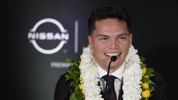 Oregon Ducks quarterback Dillon Gabriel speaks on stage during a press conference