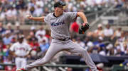 Aug 9, 2025; Cumberland, Georgia, USA; Miami Marlins starting pitcher Ryan Gusto (65) pitches against the Atlanta Braves during the second inning at Truist Park. Mandatory Credit: Dale Zanine-Imagn Images