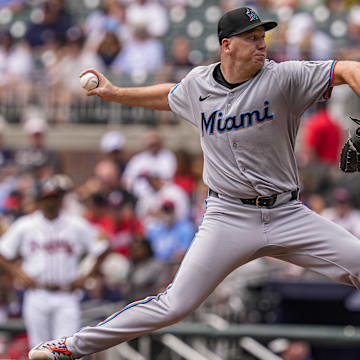 Aug 9, 2025; Cumberland, Georgia, USA; Miami Marlins starting pitcher Ryan Gusto (65) pitches against the Atlanta Braves during the second inning at Truist Park. Mandatory Credit: Dale Zanine-Imagn Images
