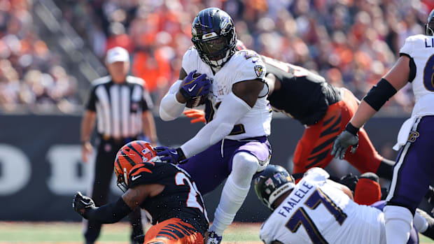 Baltimore Ravens running back Derrick Henry (22) runs the ball