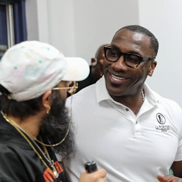 NFL Hall of Famer and former SSU football player Shannon Sharpe talks to a fan from Hinesville, Ga after signing a bottle of his Le Portier Shay VSOP Luxury Cognac at Habersham Beverage Warehouse in Savannah on Thursday, March 19, 2025.