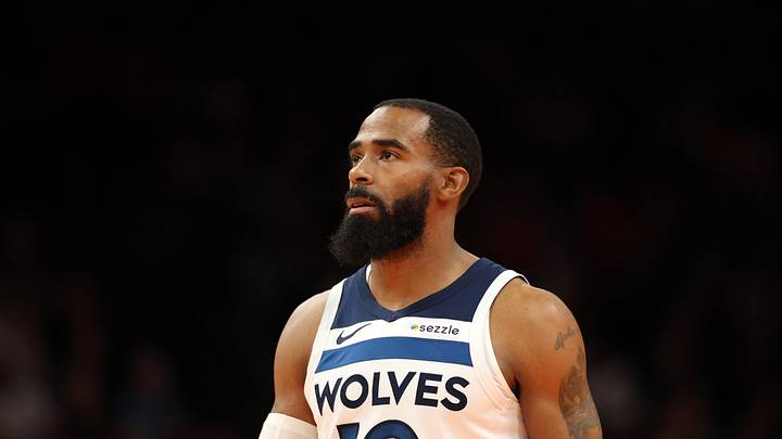 Nov 21, 2025; Phoenix, Arizona, USA; Minnesota Timberwolves guard Mike Conley (10) against the Phoenix Suns during an NBA Cup game at Mortgage Matchup Center. Mandatory Credit: Mark J. Rebilas-Imagn Images