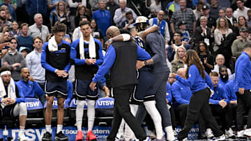 Mar 3, 2025; Dallas, Texas, USA; Dallas Mavericks guard Kyrie Irving (11) is helped off the court by forward Anthony Davis (3) during the second quarter against the Sacramento Kings at the American Airlines Center. Mandatory Credit: Jerome Miron-Imagn Images