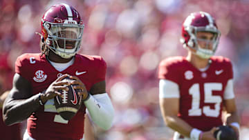 Alabama Crimson Tide quarterback Jalen Milroe (4) warms up alongside quarterback Ty Simpson (15) 