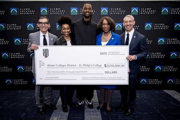 San Antonio Spurs forward Harrison Barnes (40) poses for a photo after making a donation to AlamoPROMISE.