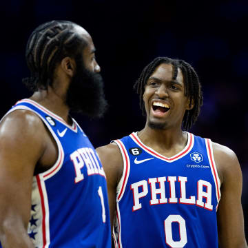 Mar 29, 2023; Philadelphia, Pennsylvania, USA; Philadelphia 76ers guard Tyrese Maxey (0) talks with guard James Harden (1) during the fourth quarter against the Dallas Mavericks at Wells Fargo Center. 