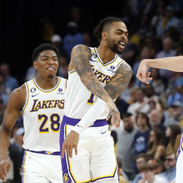 Apr 16, 2023; Memphis, Tennessee, USA; Los Angeles Lakers guard D'Angelo Russell (1) reacts with guard Austin Reaves (15) during the second half during game one of the 2023 NBA playoffs against the Memphis Grizzlies at FedExForum. Mandatory Credit: Petre Thomas-USA TODAY Sports