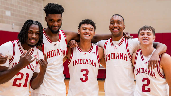 Indiana Hoosiers forward Mackenzie Mgbako (21), Indiana Hoosiers center Dallas James (42), Indiana Hoosiers guard Anthony Leal (3), Indiana Hoosiers forward Bryson Tucker (8) and Indiana Hoosiers guard Gabe Cupps (2) pose for a photo Wednesday, Sept. 18, 2024, during IU men’s and women’s basketball media day at Simon Skjodt Assembly Hall in Bloomington.