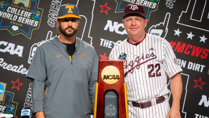 Tennessee head coach Tony Vitello and Texas A&M head coach Jim Schlossnagle pose for a photo with the championship trophy during a press conference before the NCAA College World Series finals at Charles Schwab Field in Omaha, Neb., on Friday, June 21, 2024.