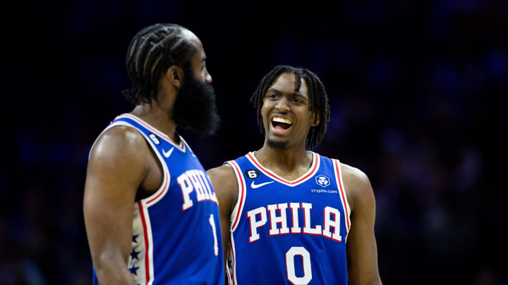 Mar 29, 2023; Philadelphia, Pennsylvania, USA; Philadelphia 76ers guard Tyrese Maxey (0) talks with guard James Harden (1) during the fourth quarter against the Dallas Mavericks at Wells Fargo Center. 