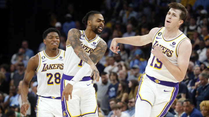 Apr 16, 2023; Memphis, Tennessee, USA; Los Angeles Lakers guard D'Angelo Russell (1) reacts with guard Austin Reaves (15) during the second half during game one of the 2023 NBA playoffs against the Memphis Grizzlies at FedExForum. Mandatory Credit: Petre Thomas-USA TODAY Sports