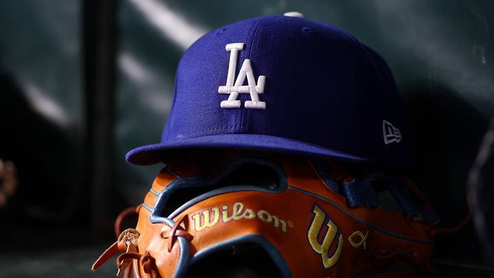 Aug 25, 2026; Atlanta, Georgia, USA; A detailed view of a Los Angeles Dodgers hat and glove on the bench against the Atlanta Braves in the eighth inning at Truist Park. Mandatory Credit: Brett Davis-Imagn Images