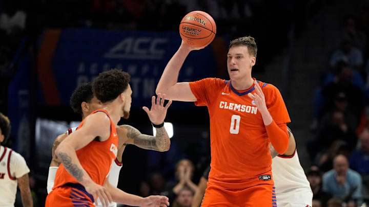 Mar 14, 2025; Charlotte, NC, USA; Clemson Tigers center Viktor Lakhin (0) looks to pass in the first half at Spectrum Center. Mandatory Credit: Bob Donnan-Imagn Images