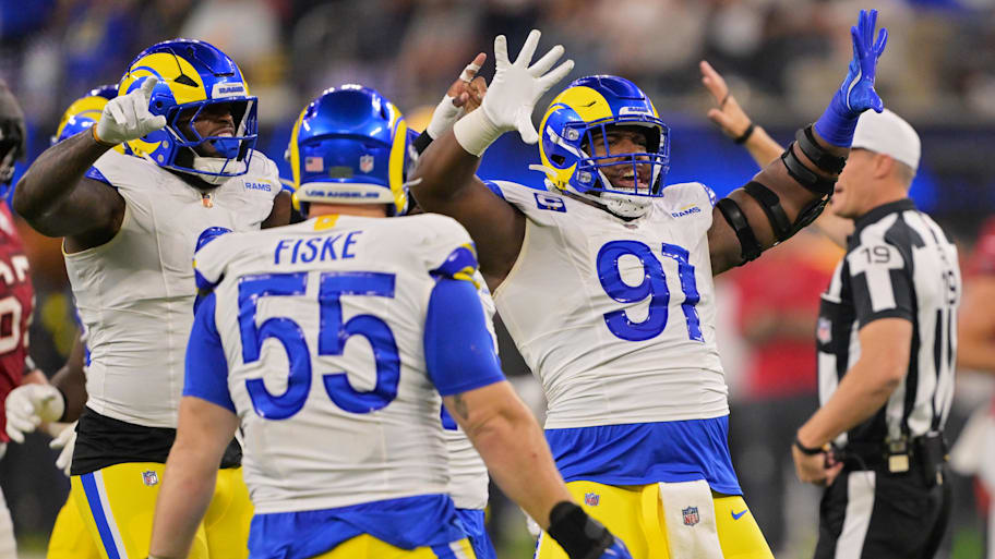 Rams defensive end Kobie Turner (91), linebacker Jared Verse (8) and defensive end Braden Fiske (55)