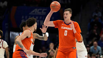 Mar 14, 2025; Charlotte, NC, USA; Clemson Tigers center Viktor Lakhin (0) looks to pass in the first half at Spectrum Center. Mandatory Credit: Bob Donnan-Imagn Images