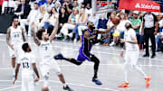 Los Angeles Lakers forward LeBron James shoots past Dallas Mavericks center Dereck Lively II and Dallas Mavericks forward Anthony Davis during the second half at American Airlines Center.