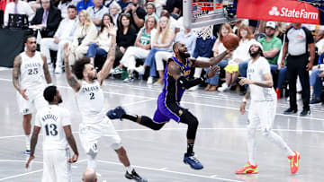 Los Angeles Lakers forward LeBron James shoots past Dallas Mavericks center Dereck Lively II and Dallas Mavericks forward Anthony Davis during the second half at American Airlines Center.