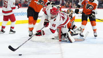 Mar 15, 2025; Philadelphia, Pennsylvania, USA; Carolina Hurricanes left wing Jordan Martinook (48) dives for the puck against the Philadelphia Flyers in the third period at Wells Fargo Center. Mandatory Credit: Kyle Ross-Imagn Images