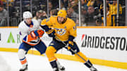Apr 8, 2025; Nashville, Tennessee, USA;  Nashville Predators center Ryan O'Reilly (90) skates behind the net against the New York Islanders during the third period at Bridgestone Arena. Mandatory Credit: Steve Roberts-Imagn Images