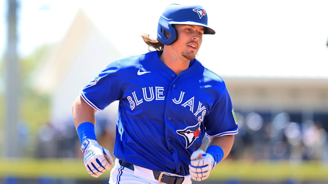 Mar 18, 2026; Dunedin, Florida, USA;  Toronto Blue Jays right fielder Addison Barger (47) hits a home run during the second inning against the Baltimore Orioles at TD Ballpark. 