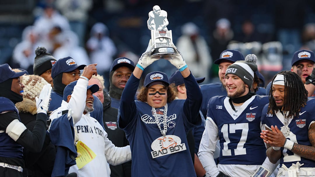 Dec 27, 2025; Bronx, NY, USA; Penn State Nittany Lions wide receiver Trebor Pena (8) holds the David C. Koch MVP Trophy after defeating the Clemson Tigers in the 2025 Pinstripe Bowl at Yankee Stadium. Mandatory Credit: Vincent Carchietta-Imagn Images