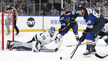 Apr 14, 2024; St. Louis, Missouri, USA; Seattle Kraken goaltender Joey Daccord (35) defends the net from St. Louis Blues left wing Pavel Buchnevich (89) during the second period at Enterprise Center. Mandatory Credit: Jeff Le-Imagn Images