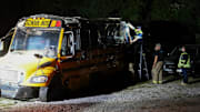 Tape is applied over broken windows on the school bus involved in a crash with the Minco softball team at Norwood Wrecker Service early Tuesday, Sep. 9, 2025, in Union City, Oklahoma.