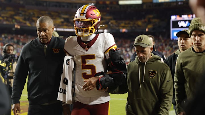 Washington Commanders quarterback Jayden Daniels exits Sunday night's game against the Seahawks.