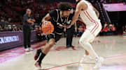 Troy Trojans guard Tayton Conerway (12) drives against Houston Cougars guard Emanuel Sharp (21) in the first half at Fertitta Center.