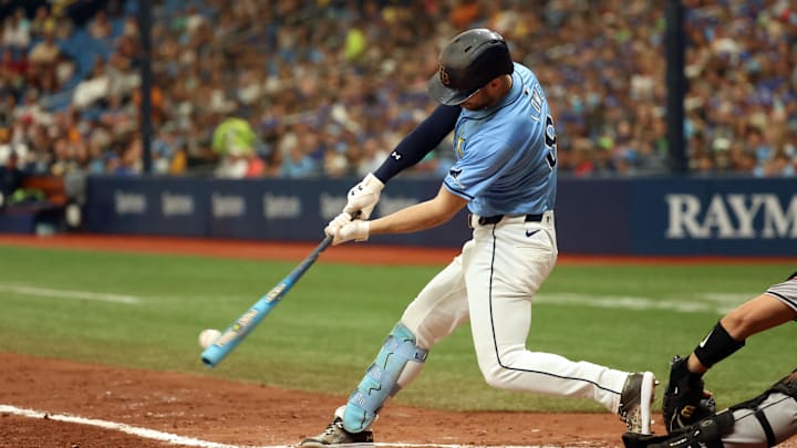 Aug 18, 2024; St. Petersburg, Florida, USA; Tampa Bay Rays designated hitter Brandon Lowe (8) singles against the Arizona Diamondbacks during the fifth inning at Tropicana Field.