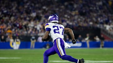 Jan 13, 2025; Glendale, AZ, USA; Minnesota Vikings running back Cam Akers (27) against the Los Angeles Rams during an NFC wild card game at State Farm Stadium. Mandatory Credit: Mark J. Rebilas-Imagn Images