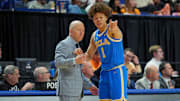 Mar 22, 2025; Lexington, KY, USA; UCLA Bruins head coach Mick Cronin talks with guard Trent Perry (1) during the first half against the Tennessee Volunteers in the second round of the NCAA Tournament at Rupp Arena. Mandatory Credit: Aaron Doster-Imagn Images