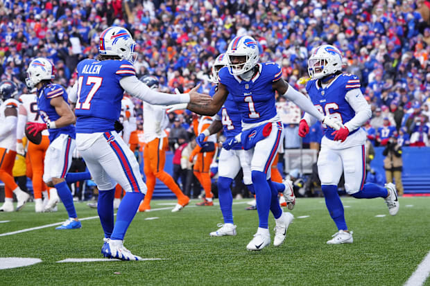 Buffalo Bills quarterback Josh Allen celebrates a touchdown by wide receiver Curtis Samuel.