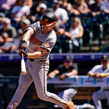 Sep 1, 2024; Denver, Colorado, USA; Baltimore Orioles shortstop Gunnar Henderson (2) hits an RBI single in the first inning against the Colorado Rockies at Coors Field.