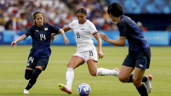 Aug 3, 2024; Paris, France; Japan midfielder Yui Hasegawa (14) and United States forward Sophia Smith (11) during the Paris 2024 Olympic Summer Games at Parc des Princes. Mandatory Credit: Yukihito Taguchi-USA TODAY Sports