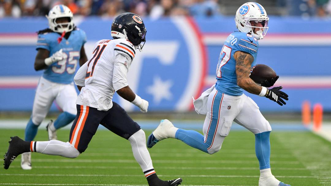 Tennessee Titans wide receiver Xavier Restrepo tries to elude Bears safety Cam Lewis in the first half Saturday night. Tennessee Titans wide receiver Xavier Restrepo tries to elude Bears safety Cam Lewis in the first half Saturday night.