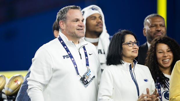 Penn State Athletic Director Pat Kraft (left) and President Neeli Bendapudi during the Fiesta Bowl at State Farm Stadium.